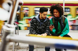 young people looking at a phone