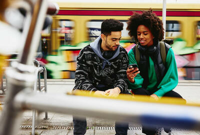 young people looking at a phone