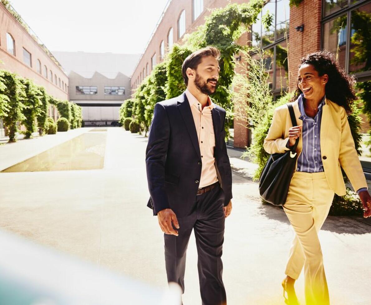 2 people walking and talking