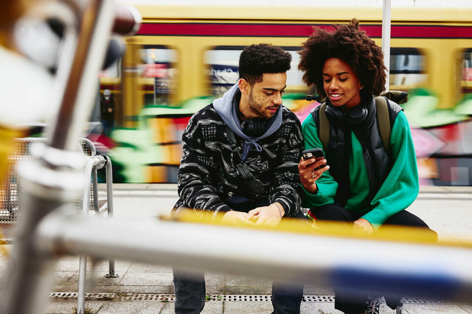 young people looking at a phone